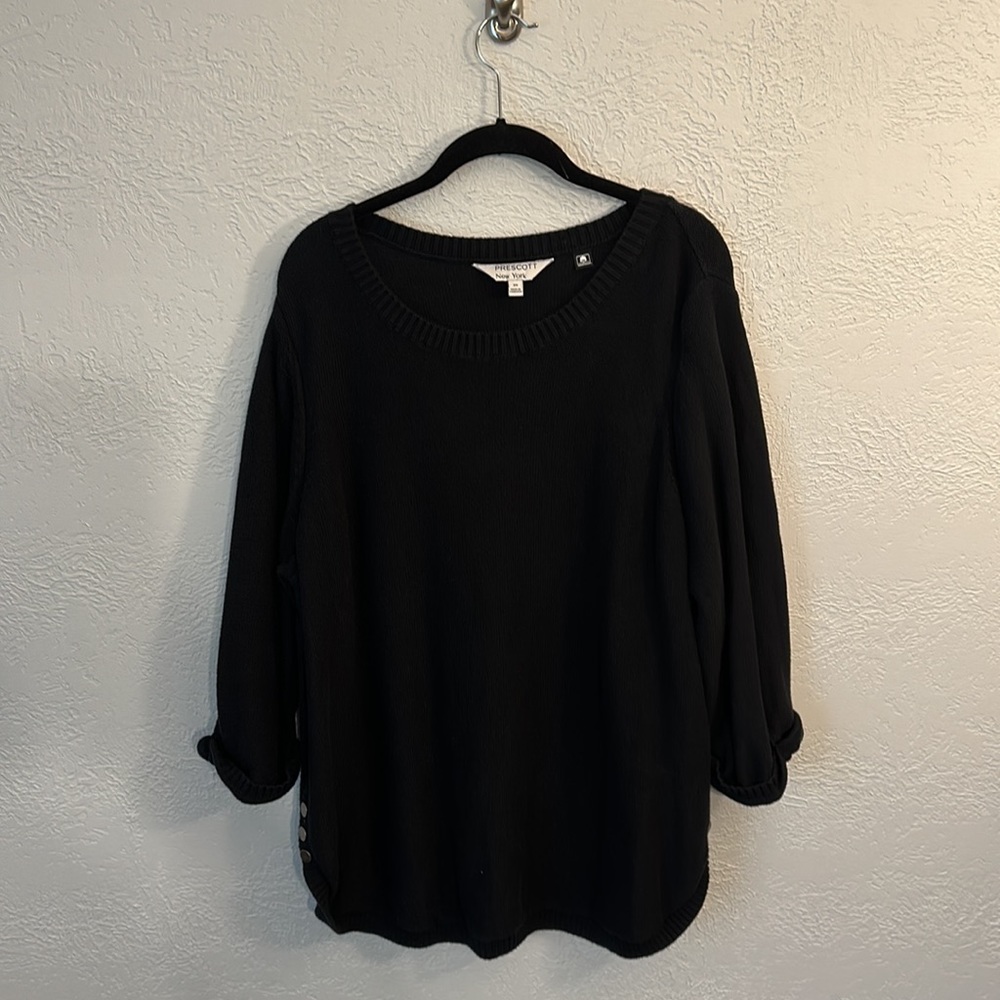 Black 3/4 length sweater with bottons on each side.